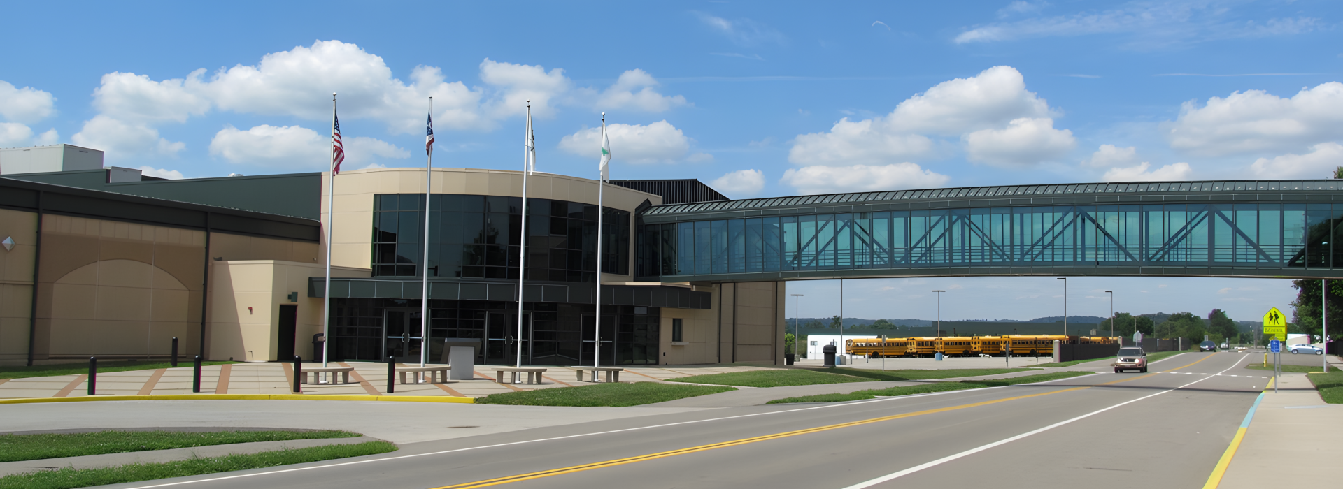 bridge over road going into building
